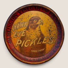Load image into Gallery viewer, Ziebarth's Antiques vintage round metal Hawk Eye Pickles advertising tray with weathered yellow and red hawk design.