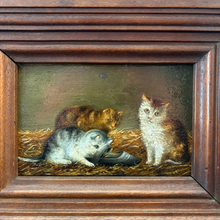 Load image into Gallery viewer, Ziebarth's Antiques vintage oil painting of three kittens in a rustic straw setting with a dark wooden frame.