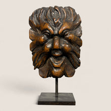 Load image into Gallery viewer, Ziebarth's Antiques hand-carved wooden Green Man mask sculpture with leaf details on a minimalist black metal stand.
