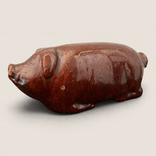 Load image into Gallery viewer, Ziebarth's Antiques vintage brown glazed ceramic pig figurine with a rustic folk art finish on a neutral background.