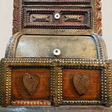 Load image into Gallery viewer, Ziebarth's Antiques hand carved wooden apothecary chest with heart motifs, roll-top compartment, and white ceramic knobs