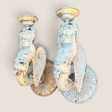 Load image into Gallery viewer, Ziebarth's Antiques pair of vintage cast iron wall sconces featuring ornate cherub figures in a distressed white finish.