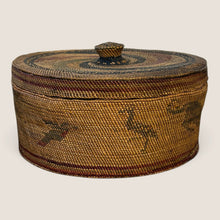 Load image into Gallery viewer, Ziebarth's Antiques handwoven lidded basket with earthy tones, intricate animal motifs, and a textured fiber finish.