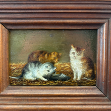 Load image into Gallery viewer, Ziebarth's Antiques vintage oil painting of three kittens in a rustic straw setting with a dark wooden frame.