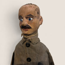 Load image into Gallery viewer, Ziebarth's Antiques vintage handcrafted wooden puppet with blue glass eyes, painted mustache, and weathered fabric coat.