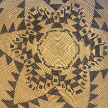 Load image into Gallery viewer, Ziebarth's Antiques handwoven wall basket tray featuring a geometric star pattern in dark brown and natural tan fibers.