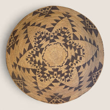 Load image into Gallery viewer, Ziebarth's Antiques handwoven decorative wall basket with a brown and tan geometric star pattern on natural fibers.